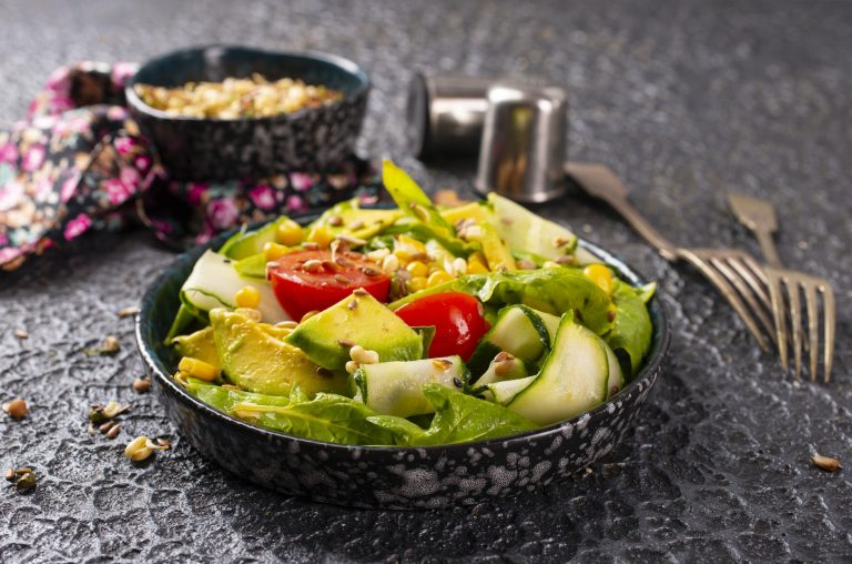 avocado, tomato and cucumber salad. Healthy vegan food. selective focus
