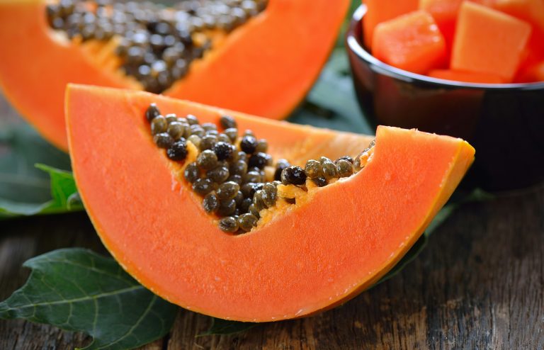 papaya slice on wood